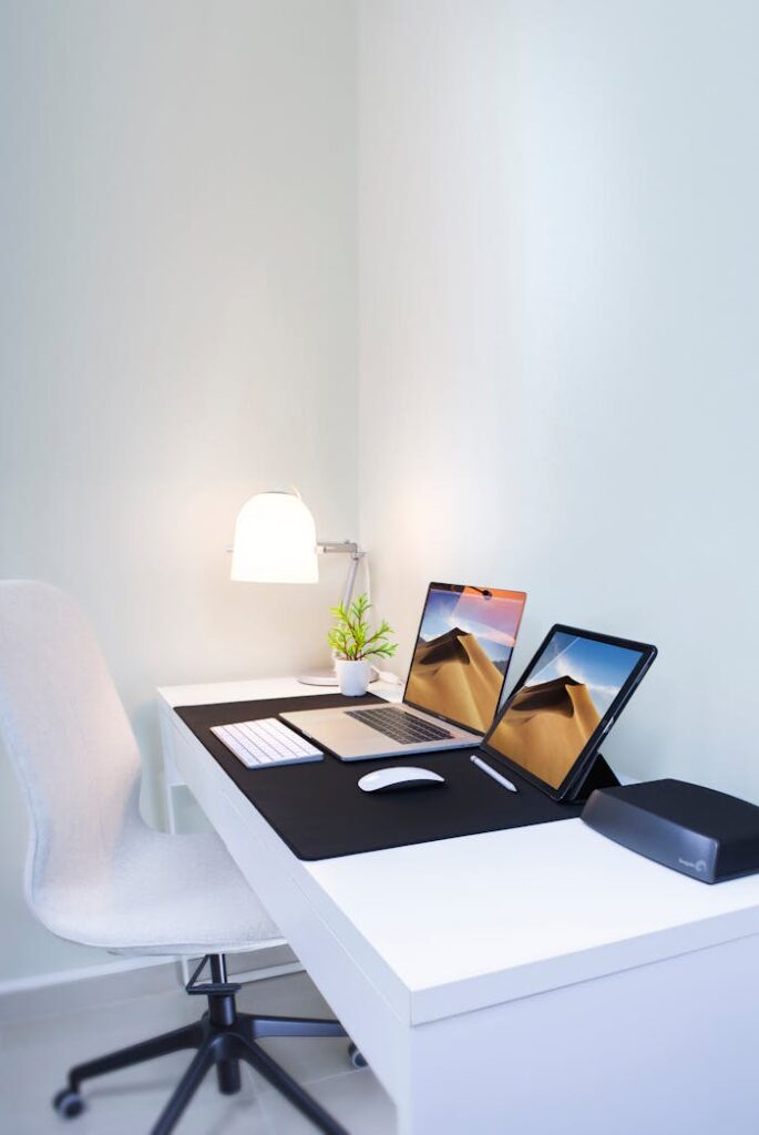 Photo of a Laptop and a Tablet on the Table